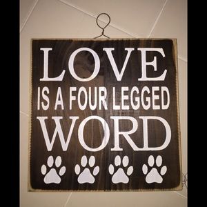 Animal plaque says: LOVE IS A FOUR LEGGED WORD.